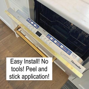 May include: A dishwasher control panel with a gold-coloured handle and trim. The panel is silver with black buttons and blue and white labels. Text on the panel reads "Thermadur" and "START/RESUME". The text "Easy Install! No tools! Peel and stick application!" is also visible.