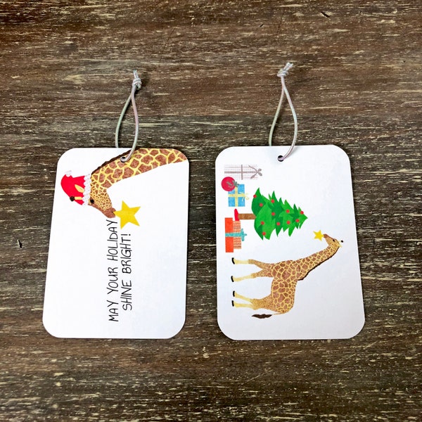 giraffe holiday gift tag with presents and a Christmas tree, 'may your holiday shine bright'