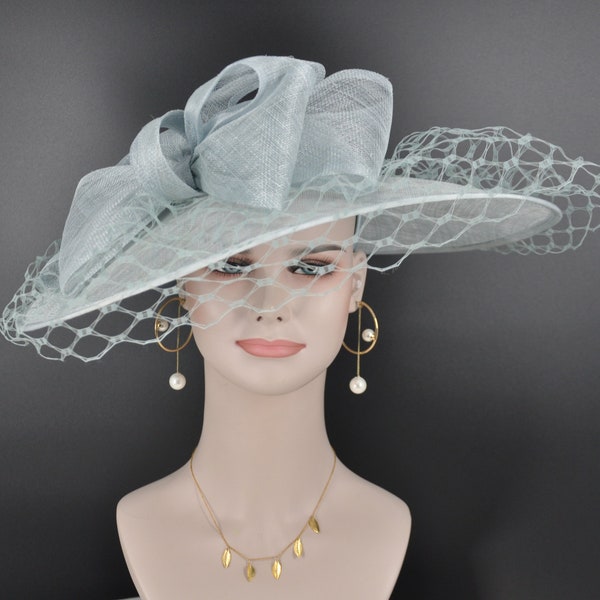 Sinamay Disc Fascinator Hat with  Jumbo Bows and netting Powder Blue