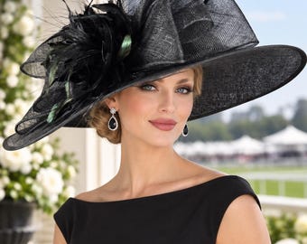 May include: A wide-brimmed black hat featuring a structured, layered mesh crown and a large decorative arrangement of black feathers on the side. The hat is crafted from a textured, woven material and displays a dramatic, sculptural silhouette.