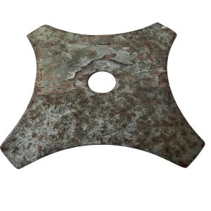 May include: A weathered, four-pointed metal object with a central hole. The object has a rough, textured surface with areas of rust and discoloration, suggesting age and exposure to the elements. The shape is symmetrical, with curved edges and pointed corners.