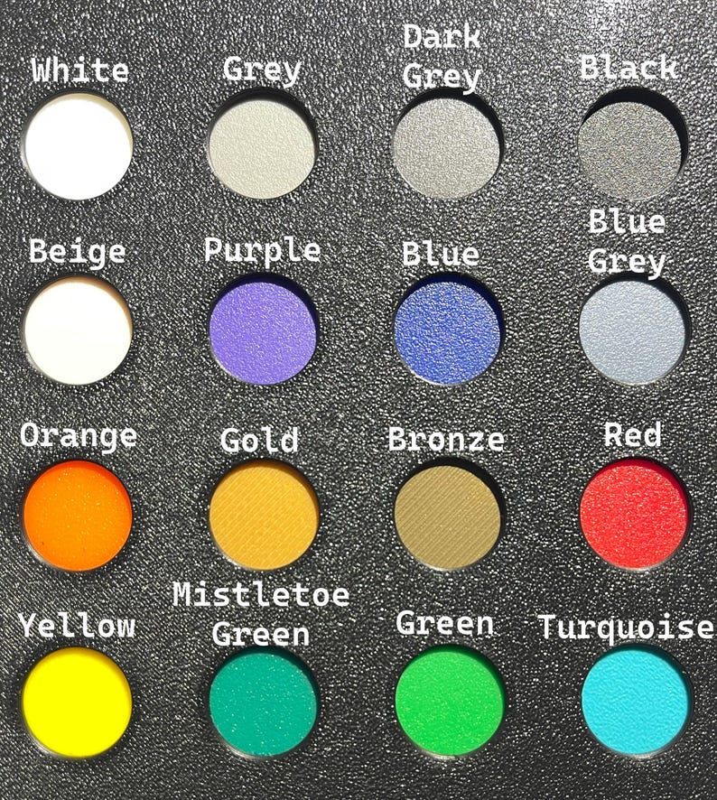 May include: A color palette featuring sixteen circular color samples, each labeled with a color name. Colors include white, grey, black, blue, orange, gold, red, yellow, green, and turquoise. The text labels are in white font.