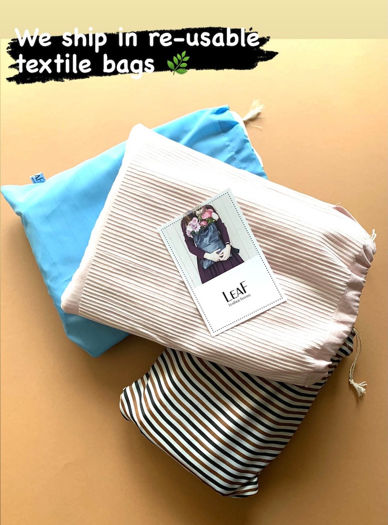 May include: Three reusable textile bags in different patterns. A light blue bag, a pink bag with a white stripe pattern, and a brown and white striped bag. The pink bag has a small card on top that says "LEAF" with a picture of a person holding a bag of flowers.