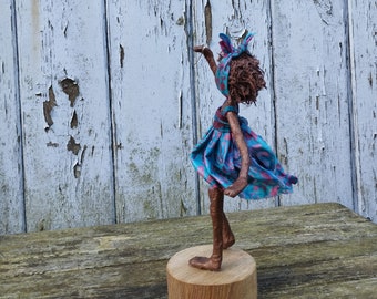 Girl with blue balloon.  Paverpol sculpture. Available