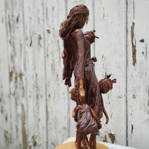 Peekaboo! Sculpture of mother and children. Family Sculpture. Paverpol Sculpture. Made to order