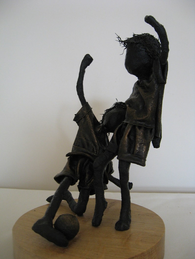 Sculpture of boys playing football Sculpture of footballer Little Footballers Made to order