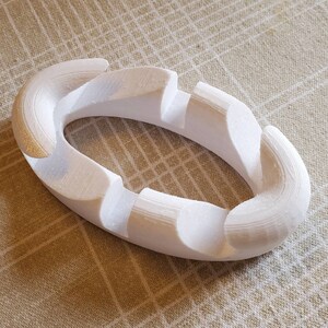 3d Printed Phone/Tablet Stand.  Multiple angles without any moving parts.  Easy to use and very portable.