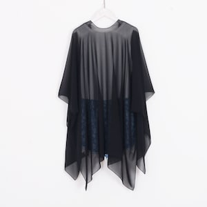 May include: Black sheer chiffon wrap with a triangular hemline. The wrap is lightweight and translucent, and it is perfect for layering over other clothing.