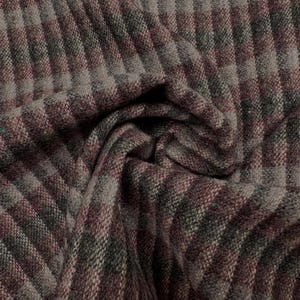 May include: Close-up of a textured fabric with a plaid pattern. The fabric features a combination of burgundy, gray, and dark green hues, creating a visually interesting design. The material is folded, showing the texture and depth of the weave.