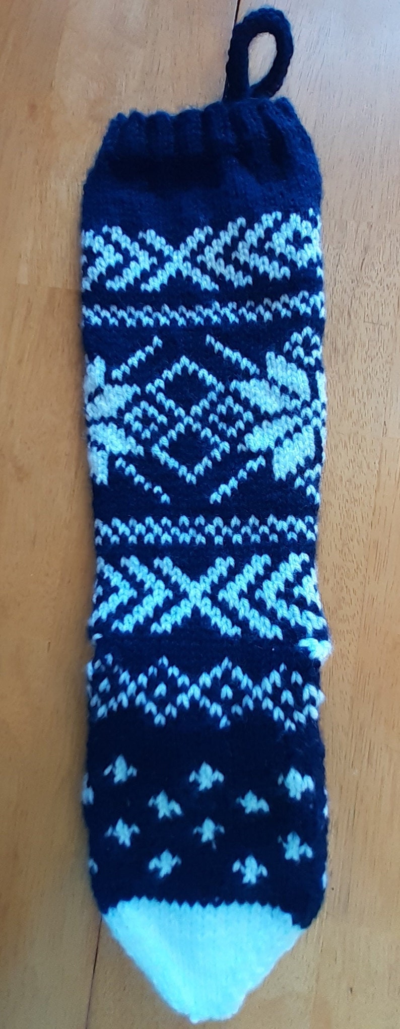 Hand knit blue and white Christmas Stocking with snowflake pattern