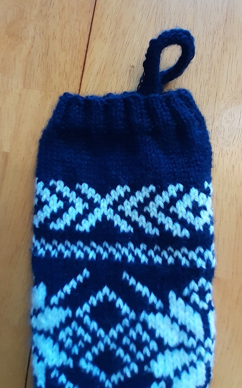 Hand knit blue and white Christmas Stocking with snowflake pattern