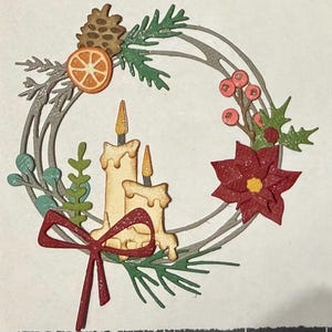 May include: A Christmas wreath design with a red bow, candles, and a poinsettia. The wreath is decorated with a pine cone, orange slice, and sprigs of greenery. The candles have a dripping wax design, and the poinsettia has a yellow centre.