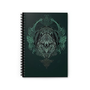 May include: A green spiral notebook featuring a wolf's head within a Celtic knot design.