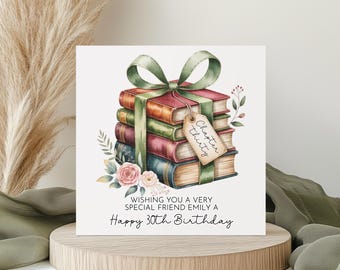May include: A birthday card with a watercolour illustration of a stack of books tied with a green ribbon and bow. The books are in various colours, with a tag that reads "Chapter Thirty." The card also includes the text "Wishing you a very special friend Emily a Happy 30th Birthday."