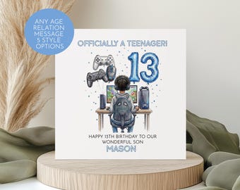May include: A white birthday card with the text "Officially a Teenager!" and "13" in blue balloon style. The card features a gamer illustration with controllers and the message "Happy 13th Birthday to our Wonderful Son Mason."
