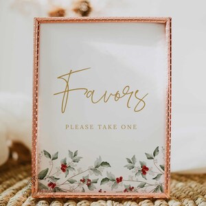 May include: A copper-colored frame with a white background and the text "Favors Please Take One". The frame is decorated with a floral design featuring red berries and green leaves.