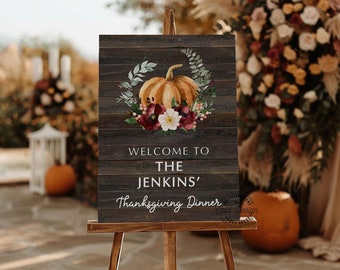 May include: Welcome to The Jenkins' Thanksgiving Dinner sign with a watercolor pumpkin and floral wreath on a woodgrain background.