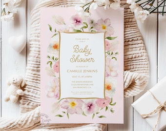 May include: A pink baby shower invitation with floral accents. The invitation features a gold-framed text box with the words "Baby Shower" and event details. The design includes watercolor flowers in shades of pink and white, with a soft, elegant aesthetic.