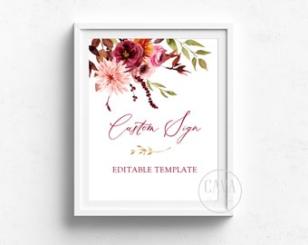 May include: A framed white sign with a floral watercolor design in shades of burgundy, pink, and orange. The text "Custom Sign" is written in a cursive font, with "Editable Template" below. A gold leaf accent is at the bottom.