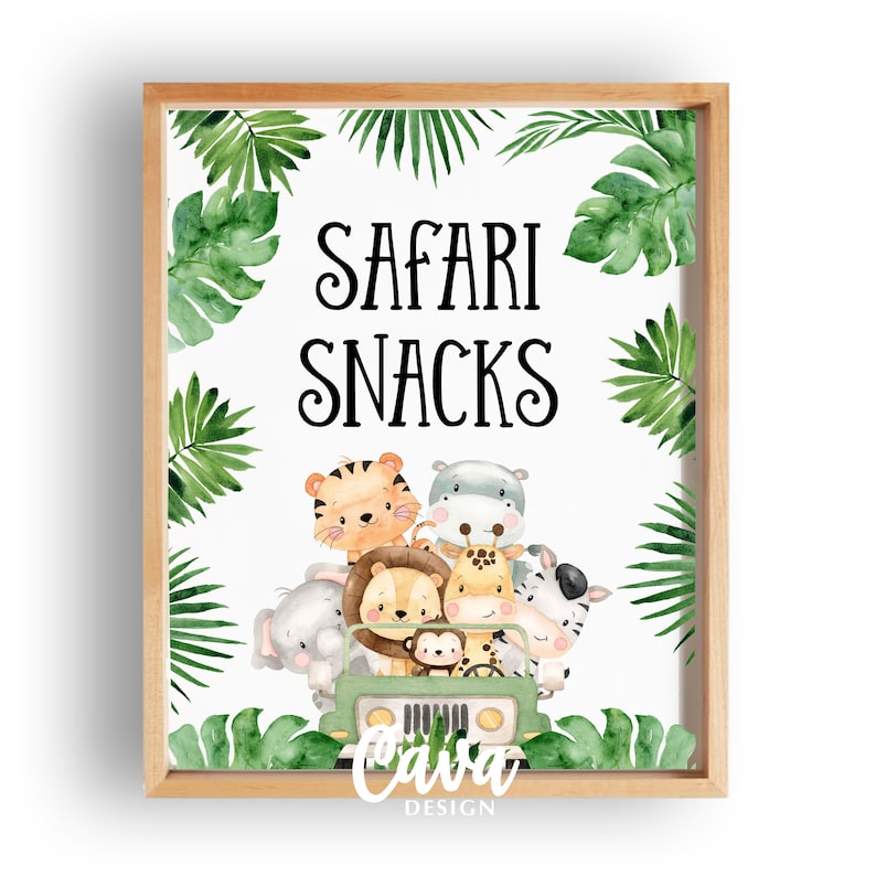 May include: A printable sign with a white background and green tropical leaves around the border. The sign says "Safari Snacks" in black text. There is a cartoon image of a green jeep with a monkey driving and a group of safari animals in the back.