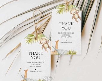 May include: Two printable thank you tags with a jungle theme. The tags feature a monkey, giraffe, and elephant with green leaves. The text on the tags reads "Thank You for showering Amanda with love" and "November 23, 2020".