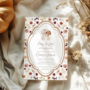 May include: A baby shower invitation with a floral design and the text "Fall in Love with Baby Jenkins." The invitation features a baby carriage illustration and the name Camille Jenkins. The date and address are also included.