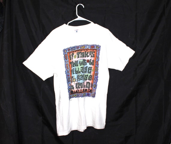 It takes a village.. Tshirt / size- Large