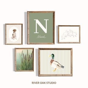 May include: A collection of five framed art prints. The prints feature a dog, a large letter "N" with the name "Noah", ducklings, cattails, and a duck. The frames are brown, and the backgrounds vary in color and pattern.
