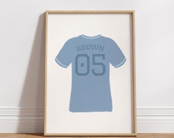 May include: A blue and white baseball jersey with the name "BROWN" and the number "05" printed on the back.