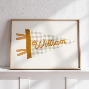 May include: A printable pennant banner with a gingham pattern in beige and white. The banner has a gold border and the name "William" is written in gold script.