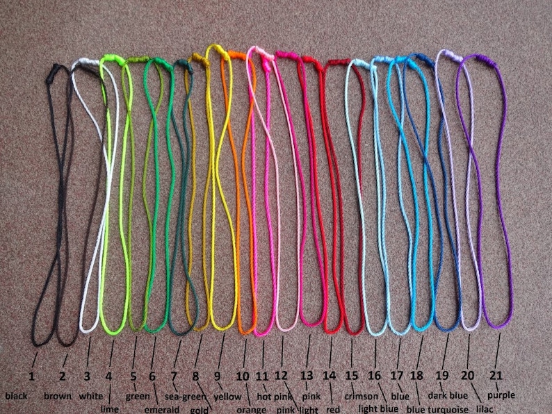 May include: Twenty-one cords of different colors, including black, brown, white, lime green, emerald green, sea-green, gold, yellow, orange, hot pink, pink, light pink, red, crimson, blue, light blue, dark blue, turquoise, lilac, and purple.