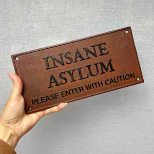 Vintage insane asylum rusted cast iron hanging wall sign - door sign