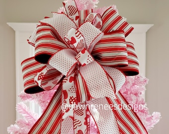 The Mariah red and white Christmas tree topper bow-bow with long