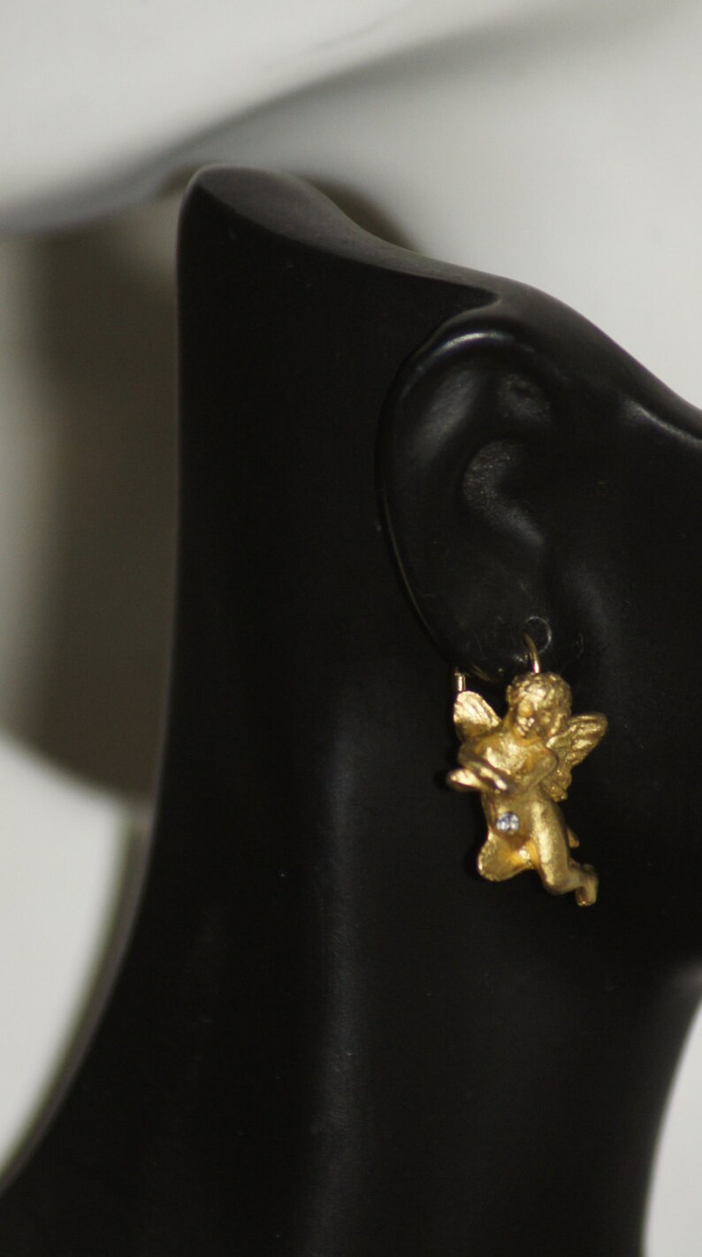 44 Ref EGPL Signed French designer CECILE JEANNE gold plated angel earrings.