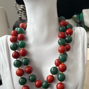 Vintage hand knotted round sponge coral and dark green Mashan jade bead necklace.