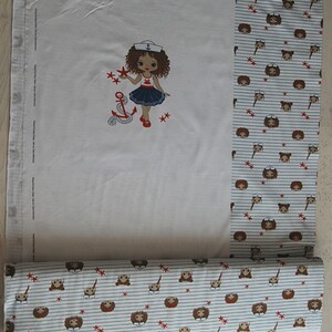 May include: White fabric with a red, white, and blue sailor girl design. The fabric has a repeating pattern of brown and white sailor girls with red stars and anchors.
