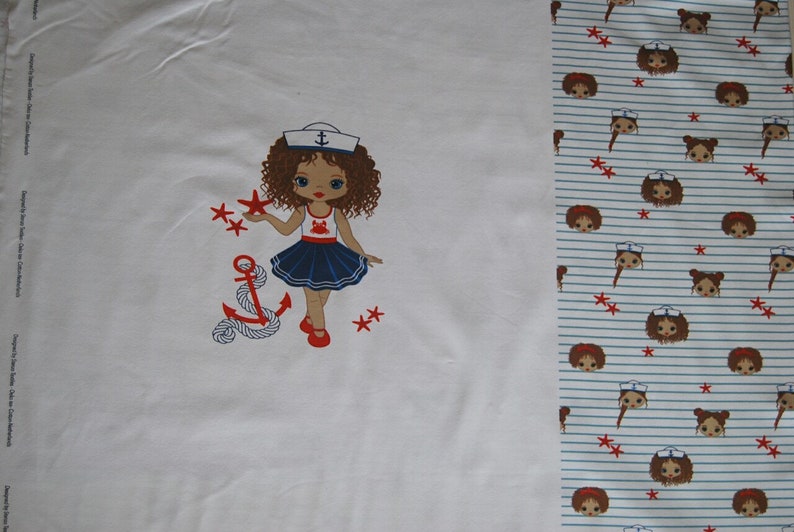 May include: White fabric with a red, white, and blue sailor girl illustration. The girl is holding a red star and there is an anchor with rope below her. The fabric has a repeating pattern of sailor girls with red stars on a white and blue striped background.