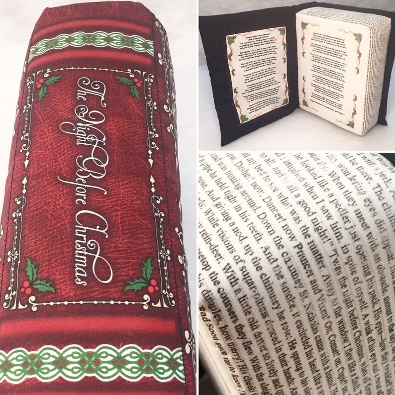 May include: A red and green book-shaped pillow with the text "The Night Before Christmas" on the front. The pillow is made to look like a vintage book with a leather cover and gold lettering.