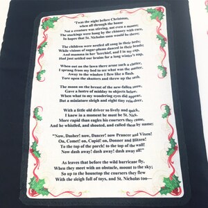 May include: A black and green Christmas card with a white border and a poem about Santa Claus and his reindeer. The poem is titled 'Twas the Night Before Christmas'.
