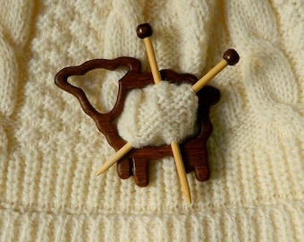 Teak wood brooch in the shape of a sheep with miniature knitting needles