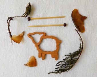 Beech wood brooch in the shape of a sheep with miniature knitting needles