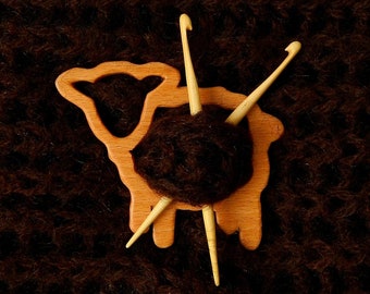 wood brooch  shaped as sheep with little  crochet  needles.