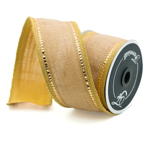 May include: A roll of burlap ribbon with gold trim. The ribbon is on a spool with a black label that says "The Original".