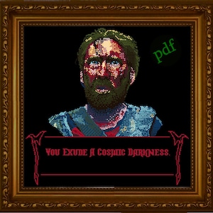 May include: Cross-stitch pattern featuring a pixelated portrait of a man with a red and blue color scheme. The text "You Exude a Cosmic Darkness." is below the portrait.