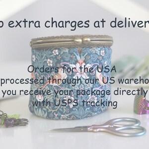 May include: A round, fabric-covered container with a floral pattern in blue and white, featuring a metal clasp. The image includes small scissors, a beaded charm, and other sewing accessories. Text on the image reads "No extra charges at delivery!"