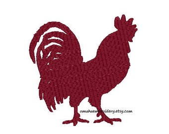 May include: A maroon silhouette of a rooster with a large comb and wattle.