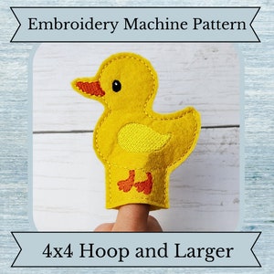May include: A yellow felt duck finger puppet with an orange beak and feet. The duck has a stitched wing and a black eye. Text at the top reads "Embroidery Machine Pattern" and at the bottom "4x4 Hoop and Larger".