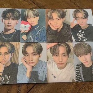 May include: Set of 8 photo cards featuring different portraits of young men. The cards are printed on a textured paper with a white background. The photos are in color and show the men with various hairstyles and expressions.
