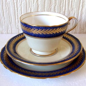 Antique  Aynsley Trio Cup Saucer, Side Plate in the Powder  Blue and Gold Laurels Very Good Condition