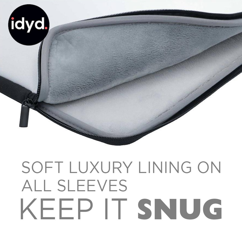 May include: A black laptop sleeve with a zipper closure. The inside of the sleeve is lined with soft gray fabric. The text "SOFT LUXURY LINING ON ALL SLEEVES KEEP IT SNUG" is printed below the sleeve.